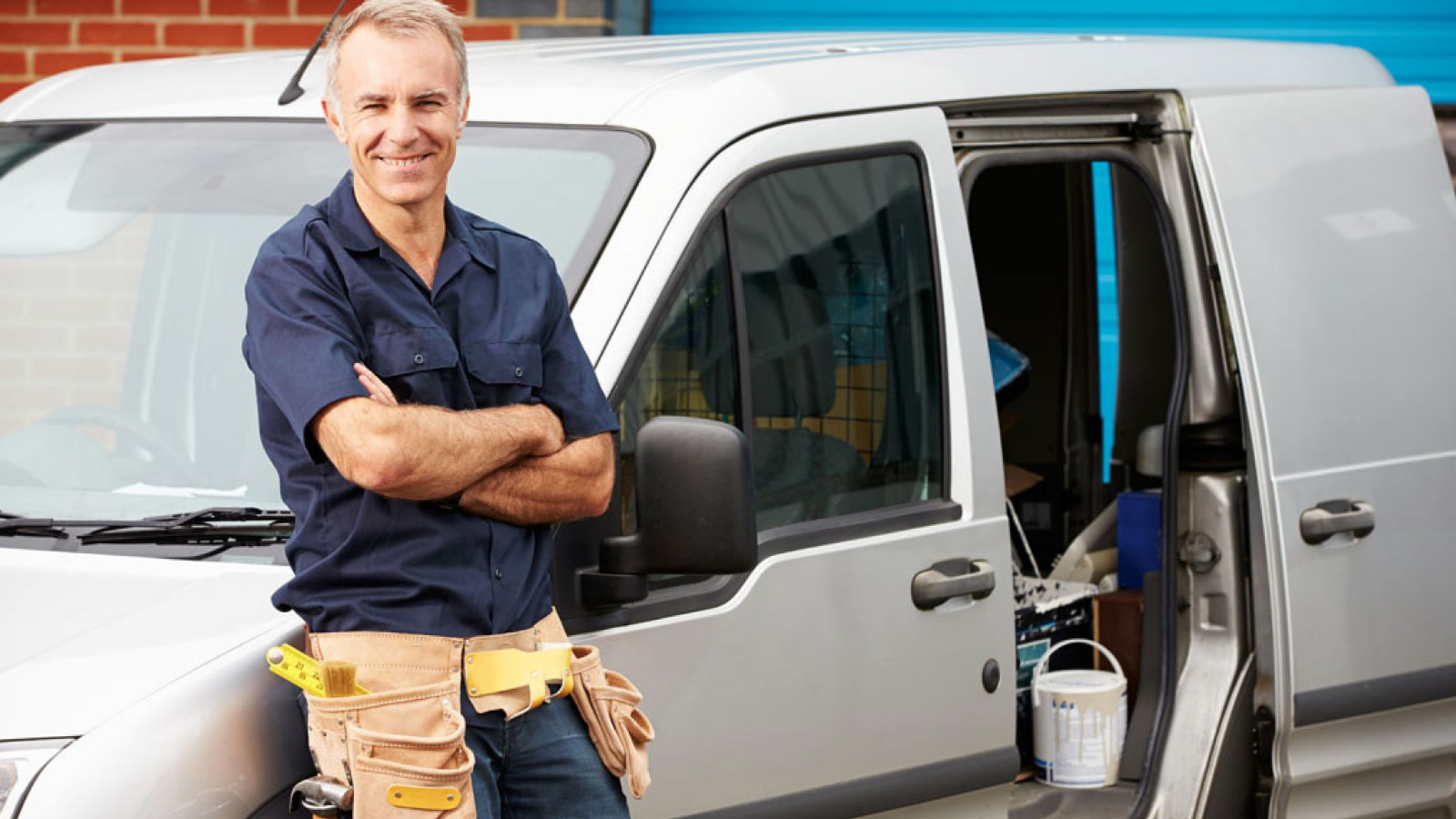 skilled plumber stands next to his van, ready to take any any new jobs from their website