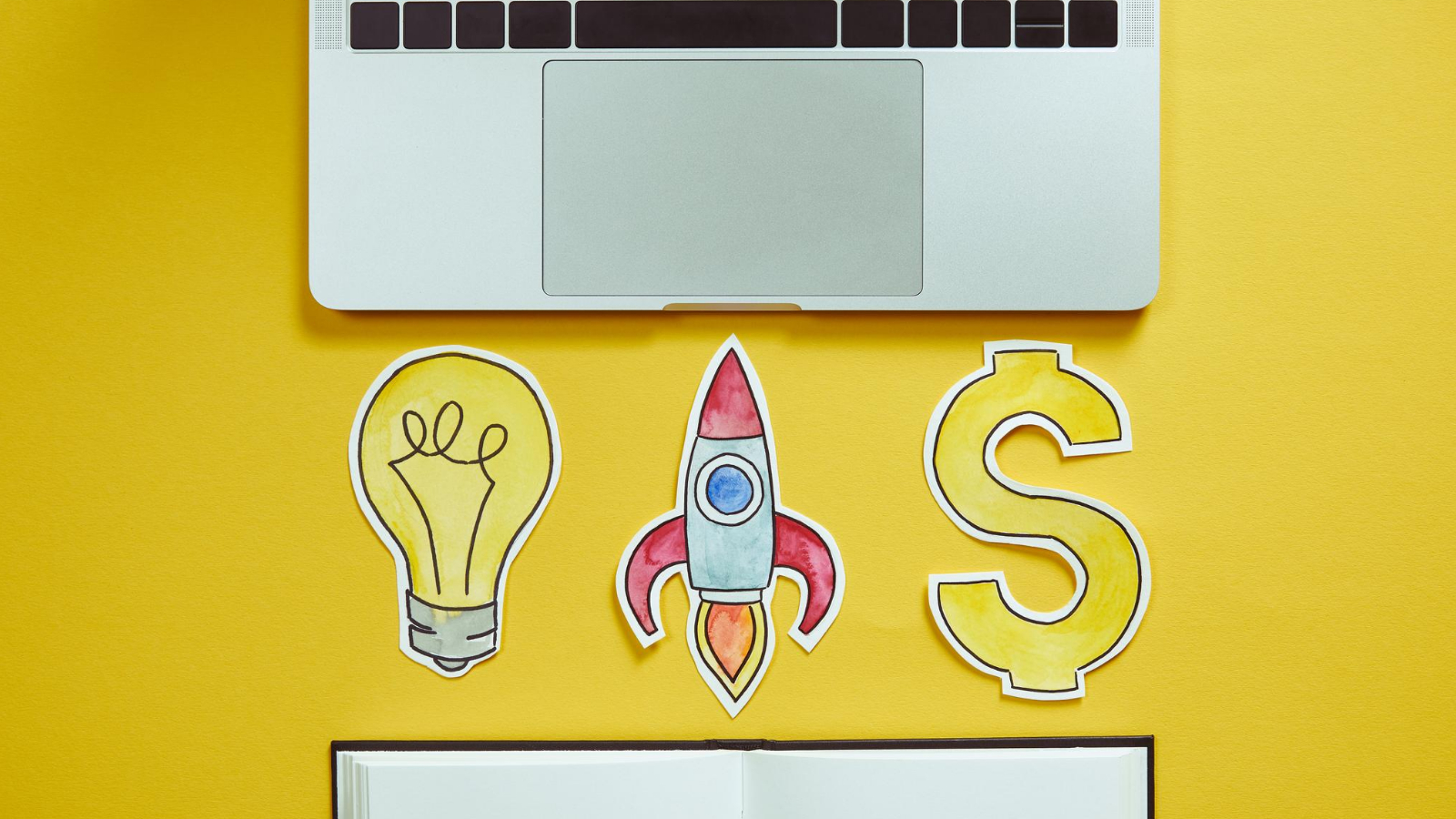 symbol of a rocket dollar bulb in front of a sleek laptop, representing the potential for financial success and growth using targeted keywords